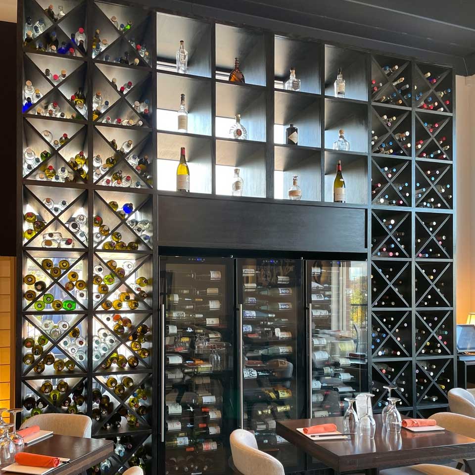 Shelves of wine bottles covering a full wall at top wine restaurant, Margaret Kuo's Kitchen at Granite Run Promenade